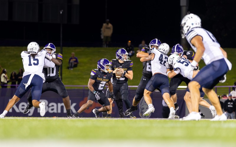 UAlbany QB Kai Colón lines up for a pass at Bob Ford Field.