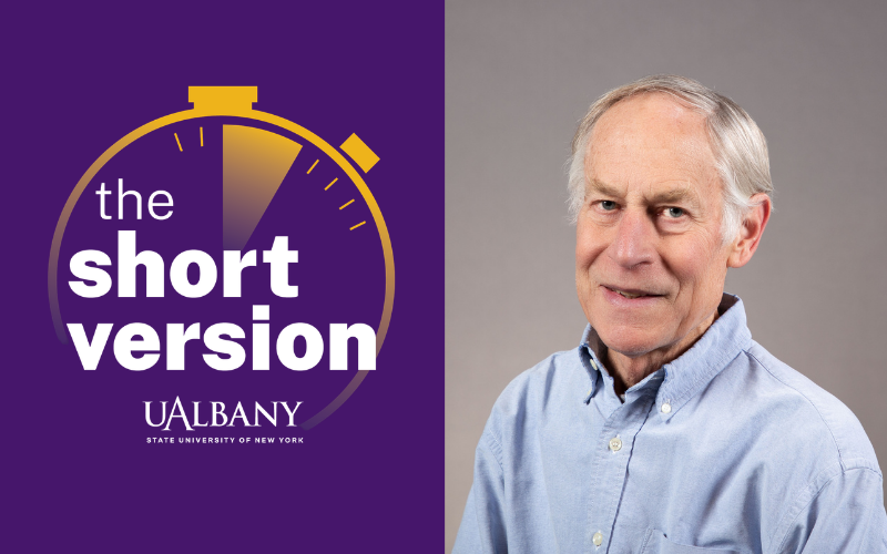 A split image with the left side including the text "The Short Version" in white over a purple background and the ride side including the smiling portrait of man with white hair and light blue collared shirt.