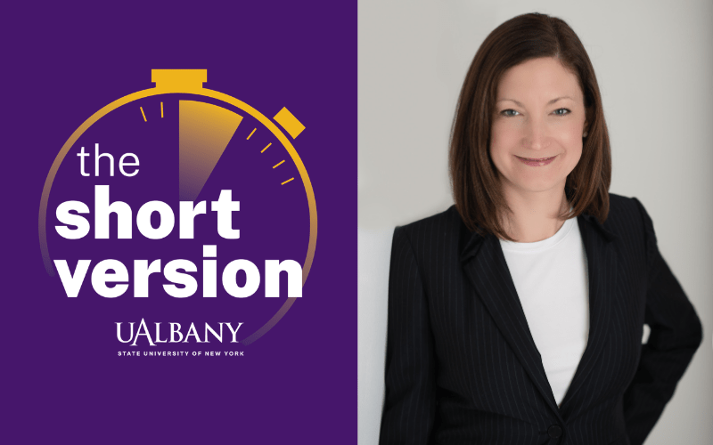 A split image featuring a smiling portrait of woman in a dark blazer on the right and a yellow stop watch logo against a purple background with the words "The Short Version" on the left.