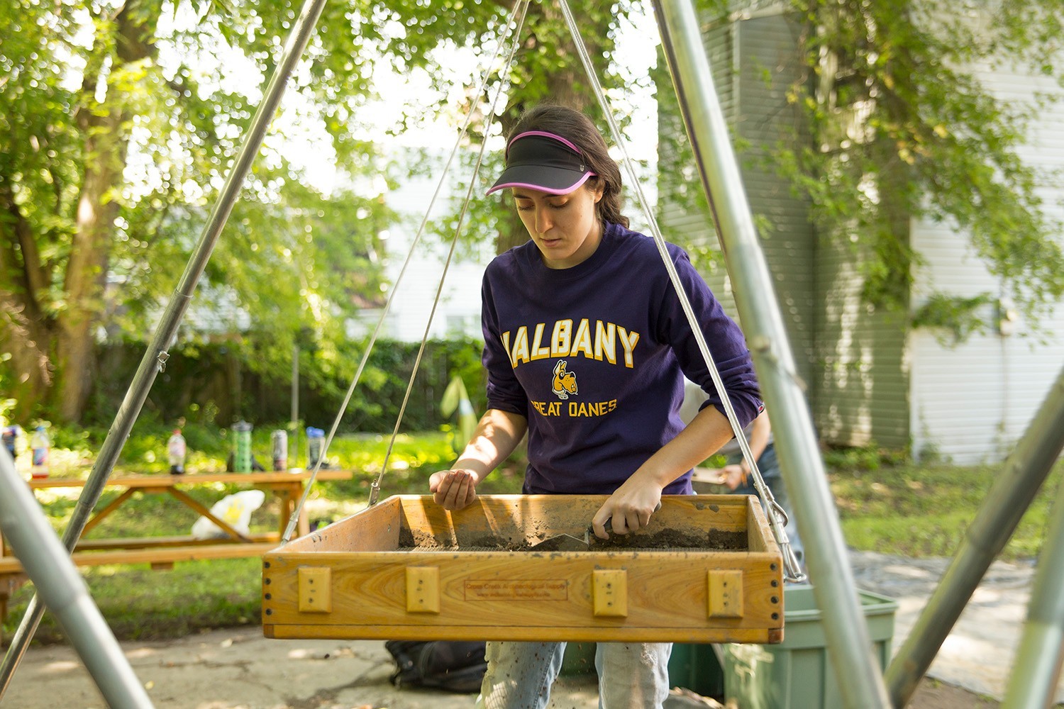 A UAlbany anthropology student working on an archaeological dig site.