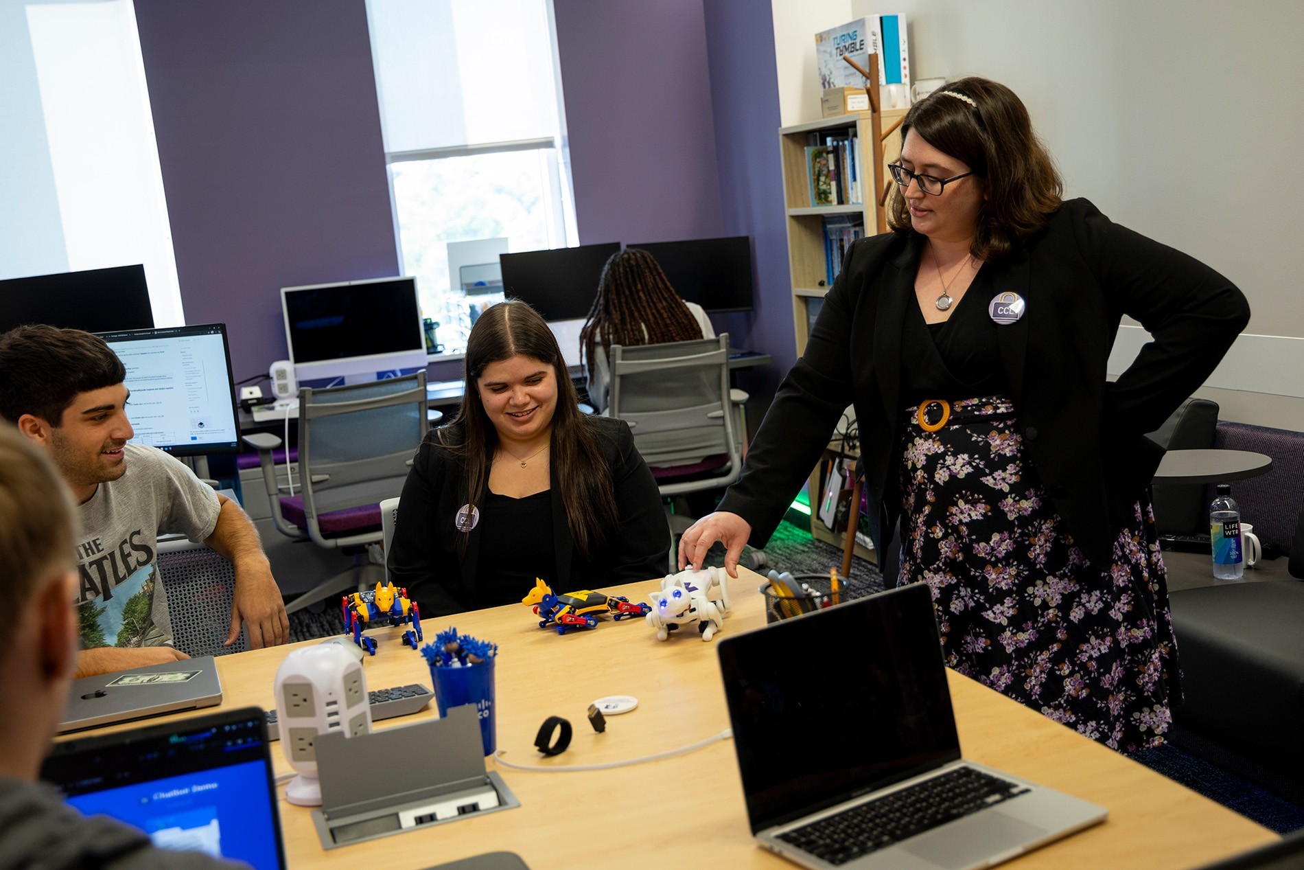 Professor Kimberly A. Cornell interacts with students in the Cybersecurity and Cryptography Lab.
