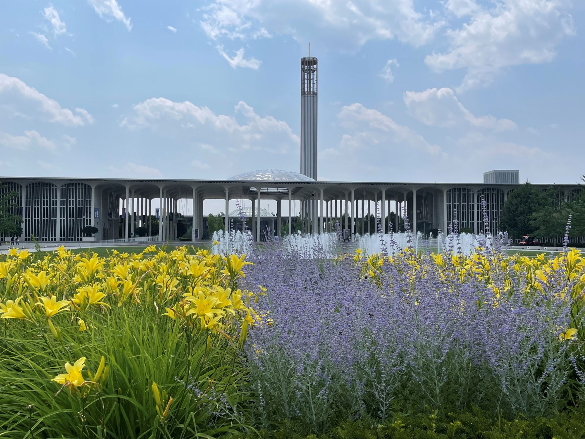 The front part of UAlbany's uptown campus, lined with flowers.