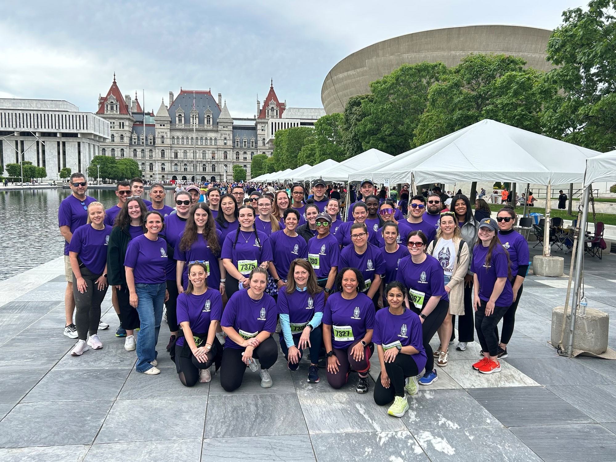 UAlbany's 62 participants pose for a photo at the 2026 CDPHP Workforce Challenge on the Empire State Plaza in downtown Albany.