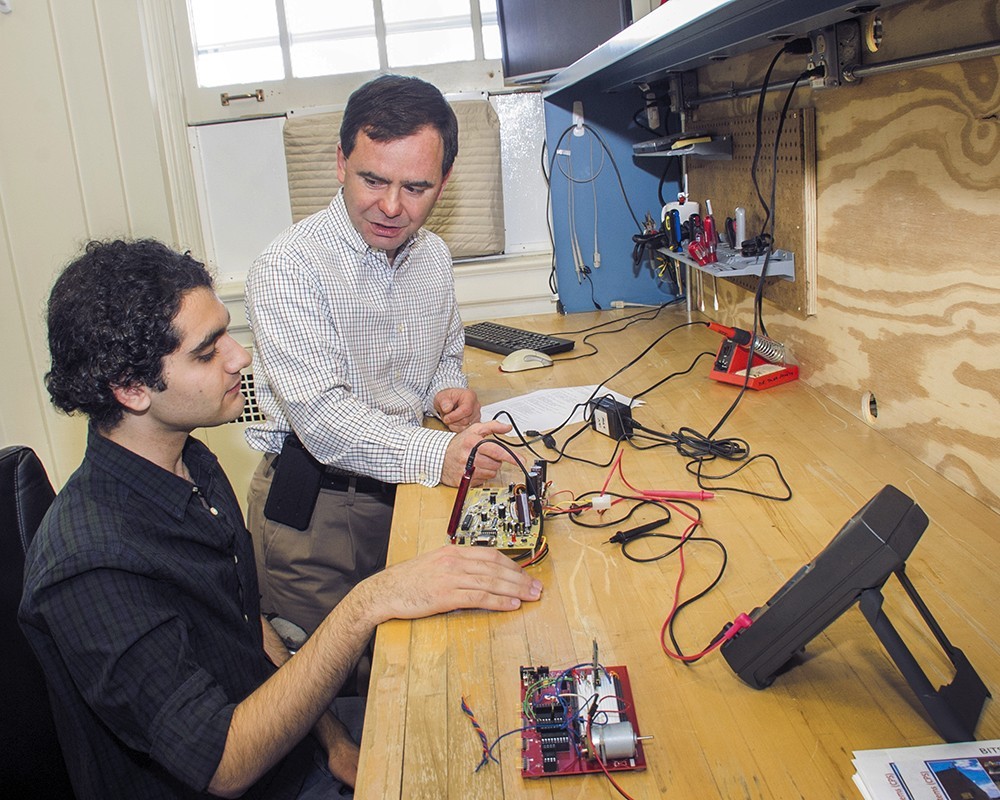 Two researchers working in a UAlbany computer engineering lab.