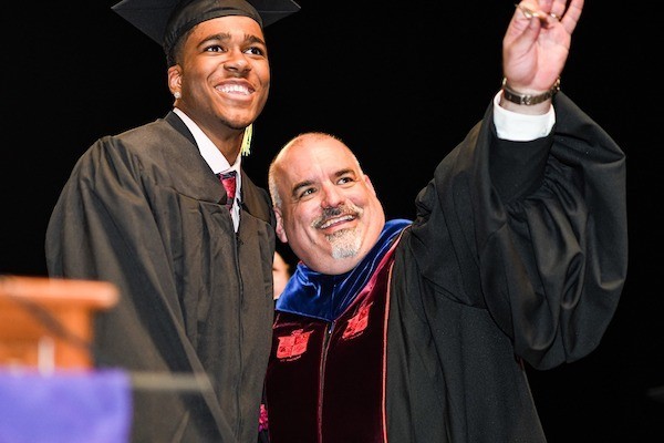 cehc dean griffin with student at graduation 