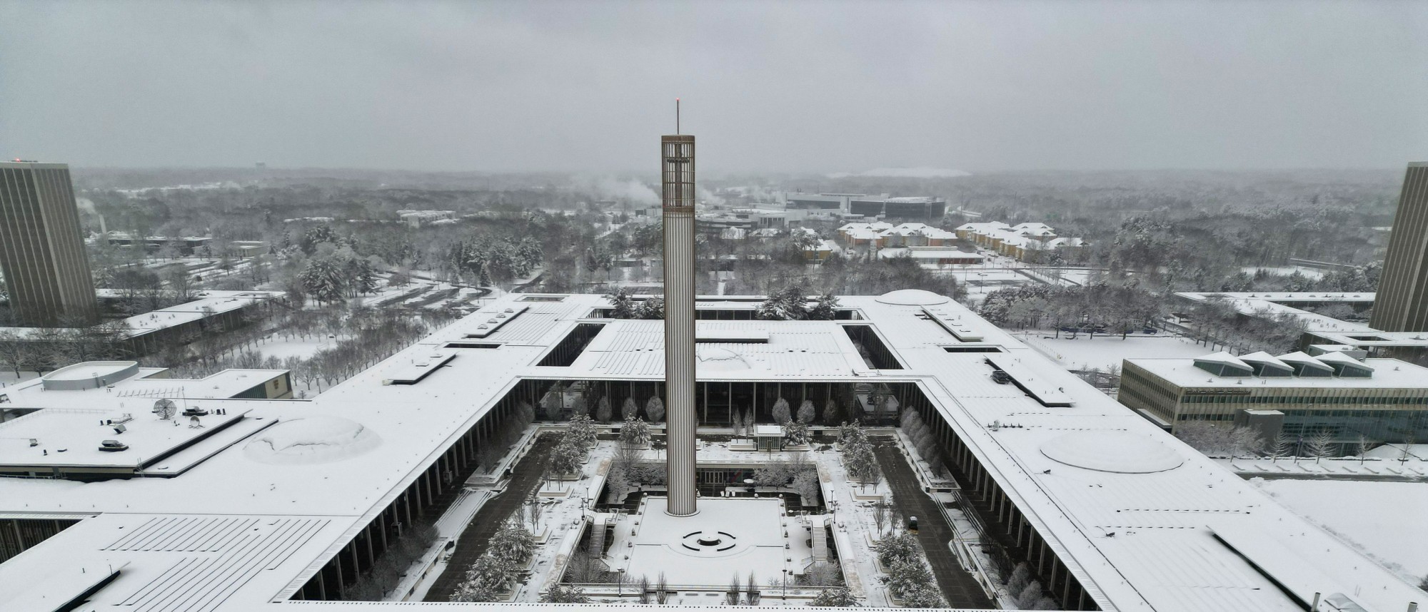 The Uptown Campus covered in snow, photographed from a drone.