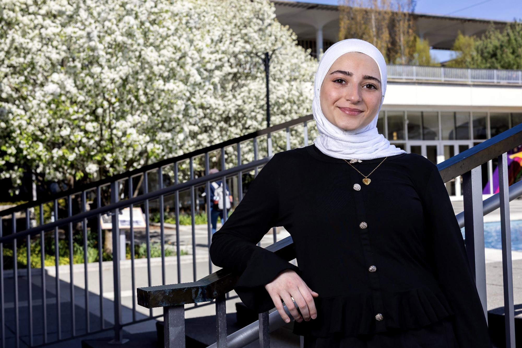 A potrait of UAlbany student Massa Masri outside near the main fountain