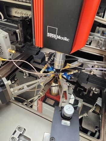 Advanced equipment labeled Suss Microtec is shown in a laboratory setting.