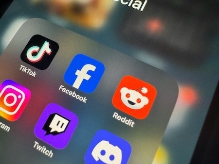 Popular social media apps in a folder labeled "social media" on a phone screen