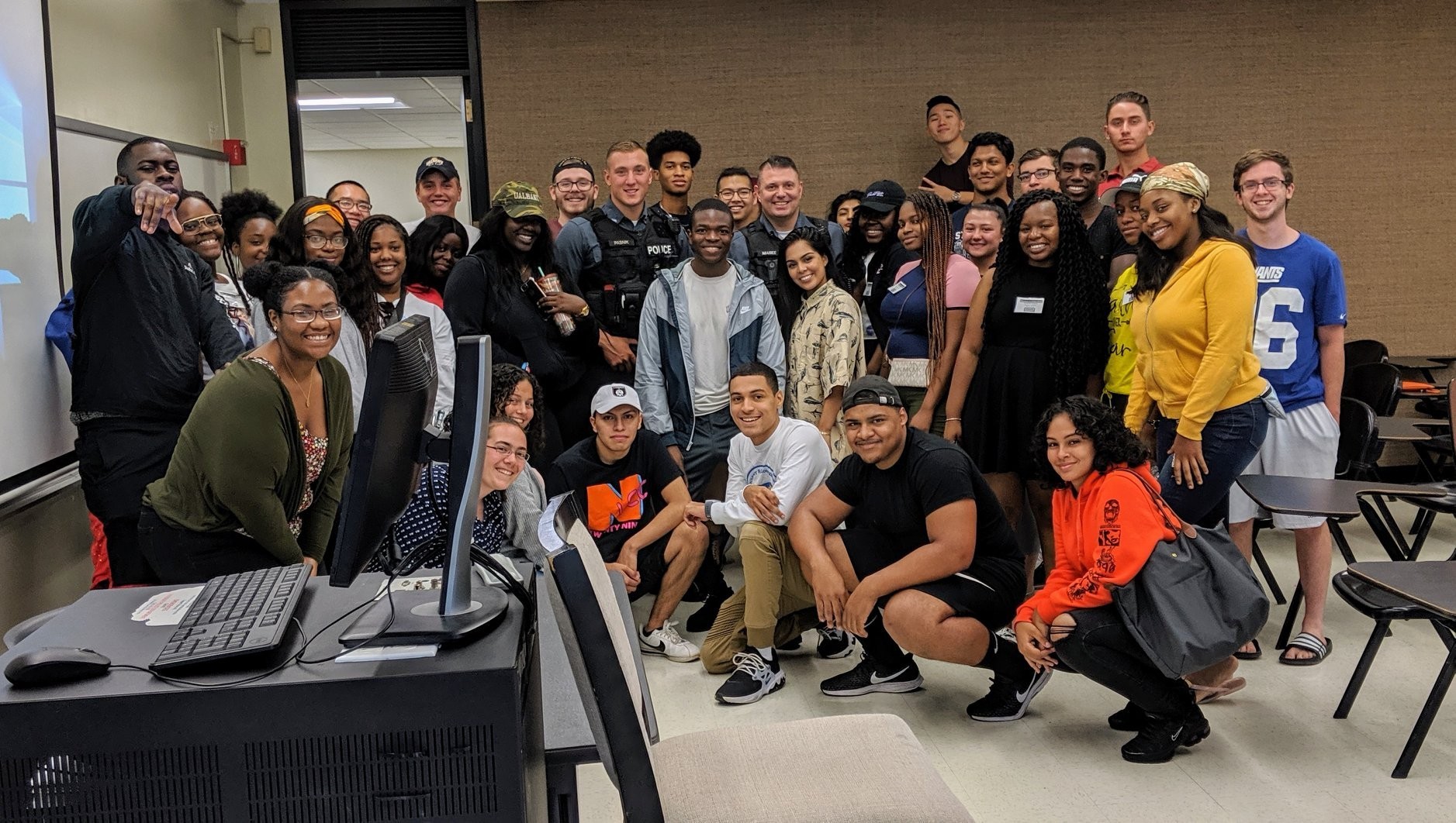 UPD Officer with students in classroom
