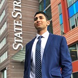 Ayman Salloum portrait in front of a State Street building