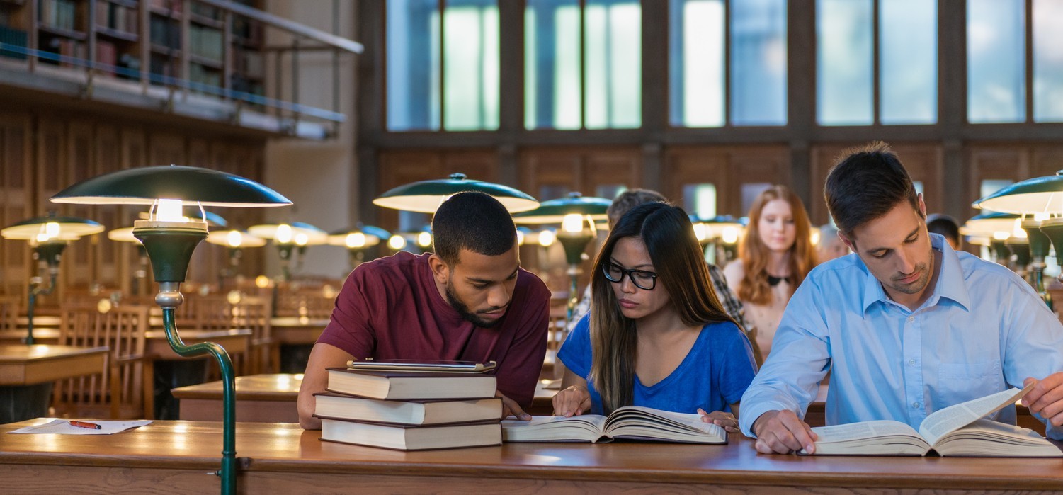 Group of students studying in a library