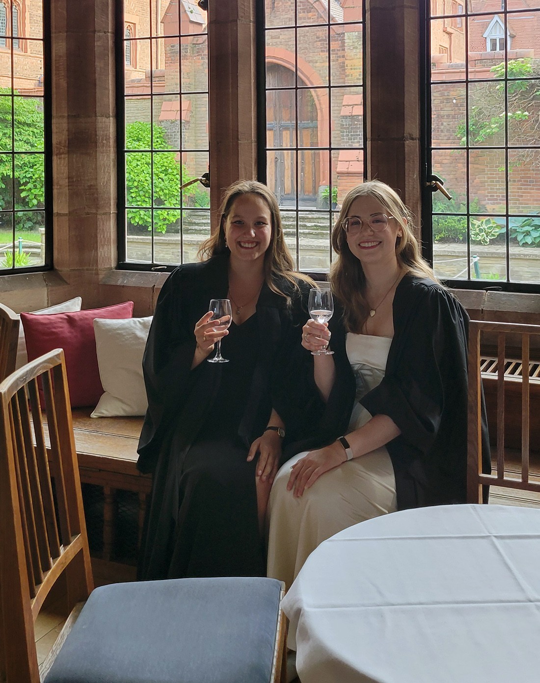 Kate Bucek sits with a friend in the campus commons room at Cambridge University.