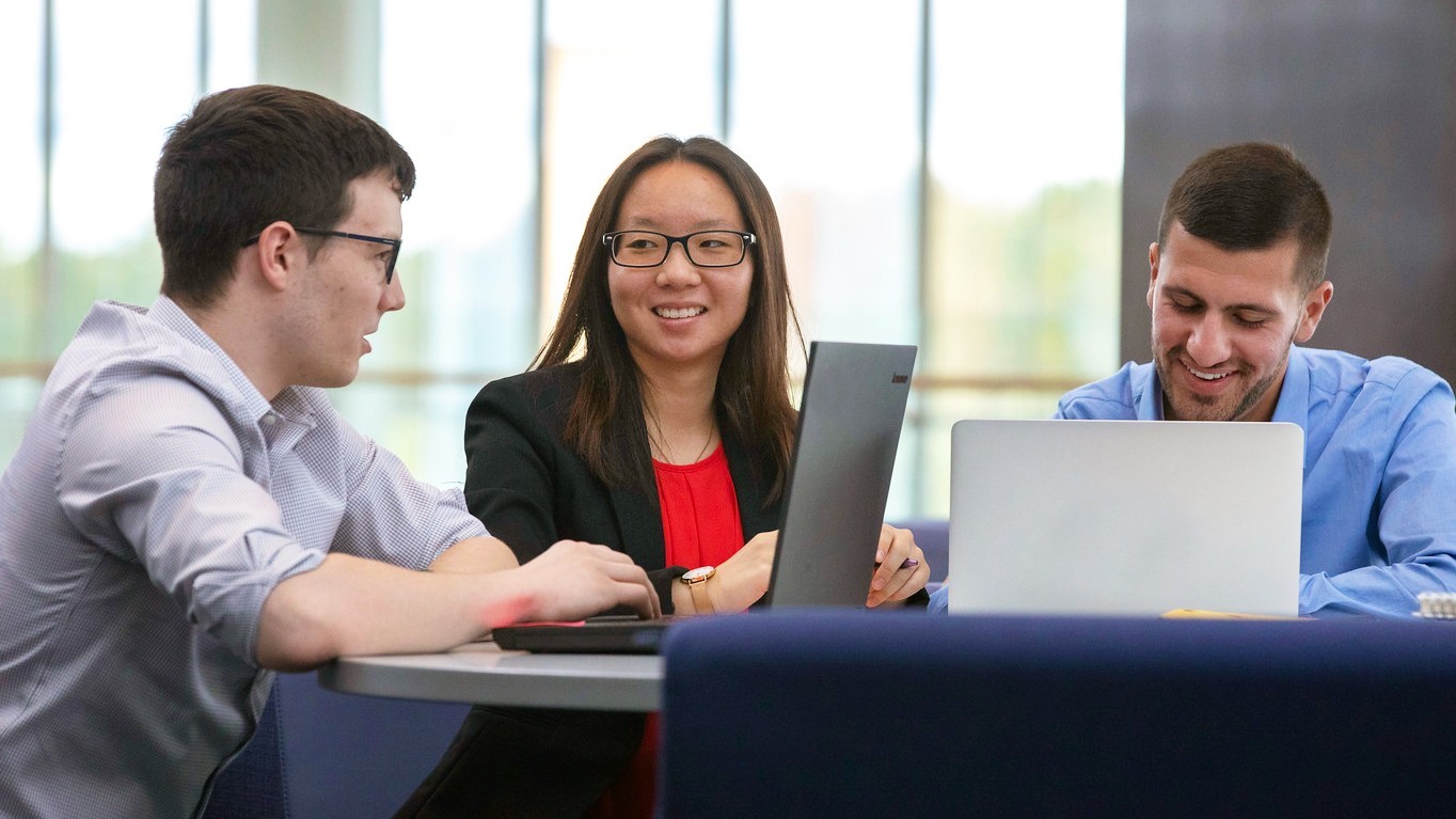 A group of students studying in the UAlbany Massry Center for Business