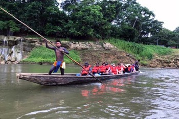 A group of UAlbany MBA students on a small boat in Embera Village in Panama.