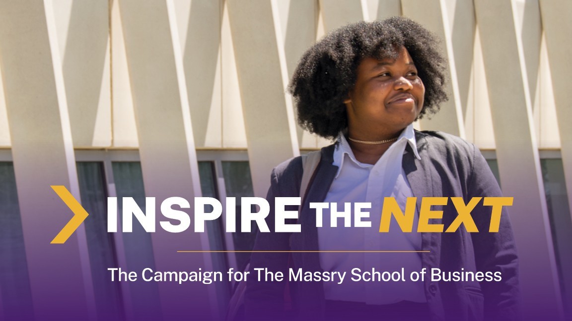 A smiling student stands in front of the UAlbany Massry School of Business building with the campaign logo, Inspire the Next: The Campaign for the Massry School of Business.