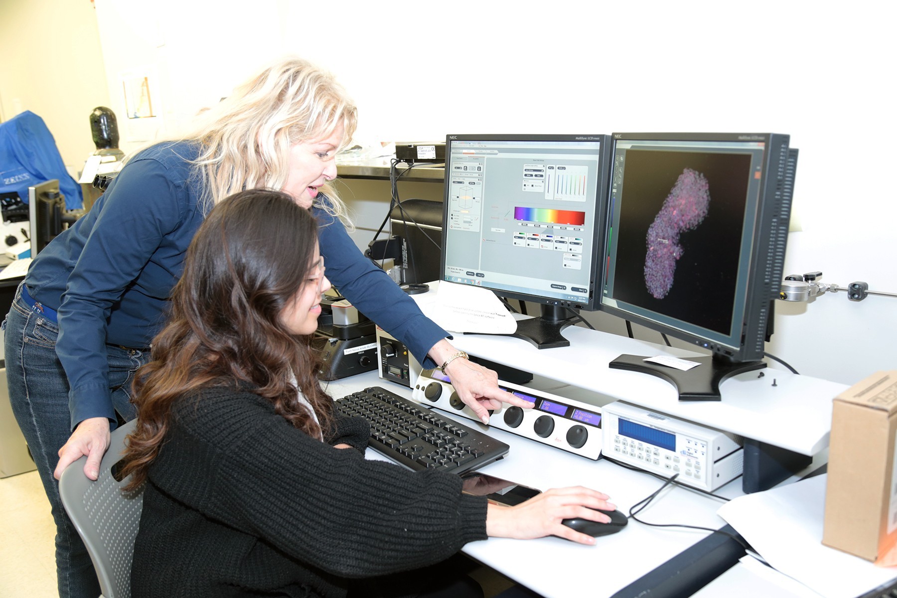Janet Paluh, left, and Maria Paredes-Espinosa in Paluh's lab.