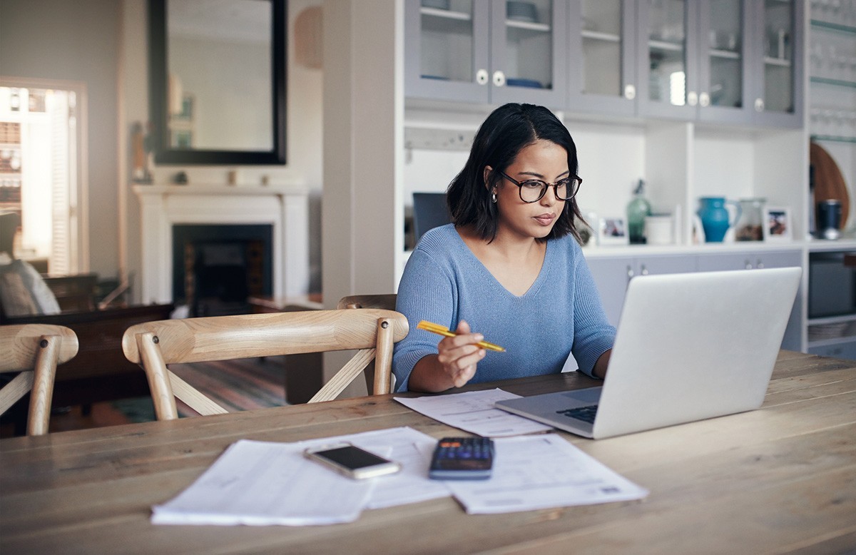 A young professional working on a laptop