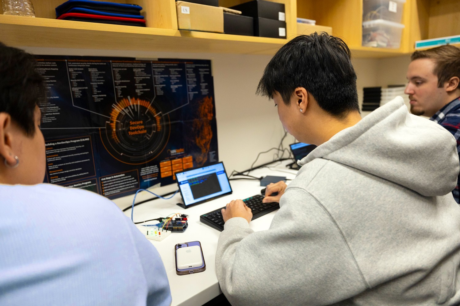 A student working on a computer in the UAlbany Cyber Cascade Risk Lab.