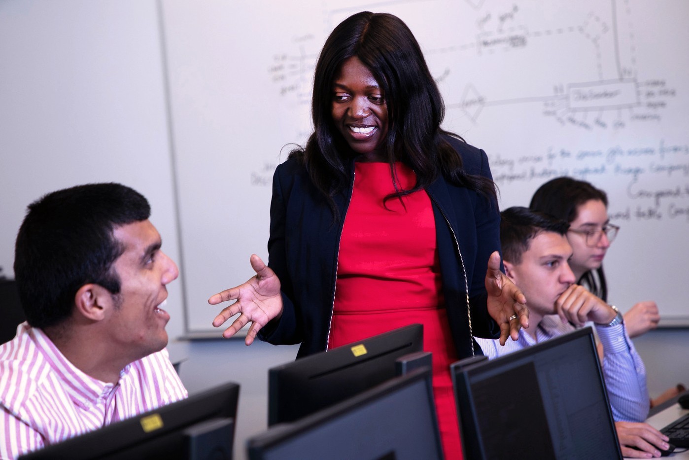 Digital Forensics and Cybersecurity students working in a computer lab