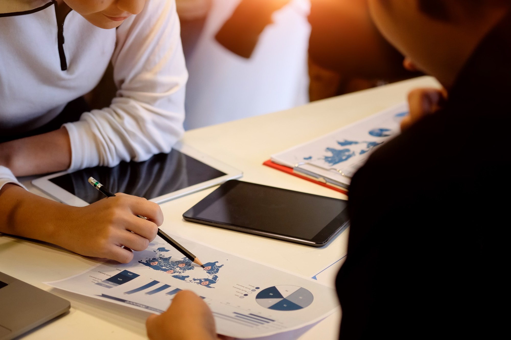 Two professionals reviewing a data report