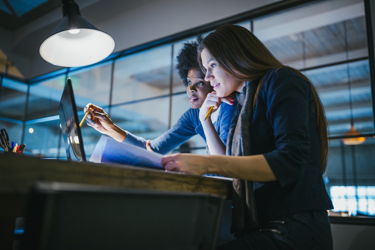 Young professionals working at a computer