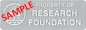 A sample of a Research Foundation asset tag. This tag is grayish silver, with the words "Property of the Research Foundation."