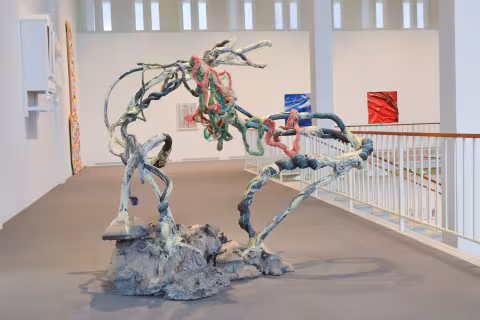 a rock sculpture with thread on it