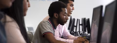 Students work on a project in a computer classroom for digital forensics