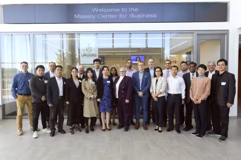 school of business faculty and staff at finance symposium