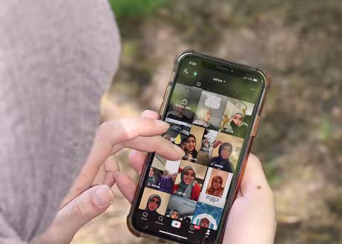 Hashimee checks her TikTok page on her phone