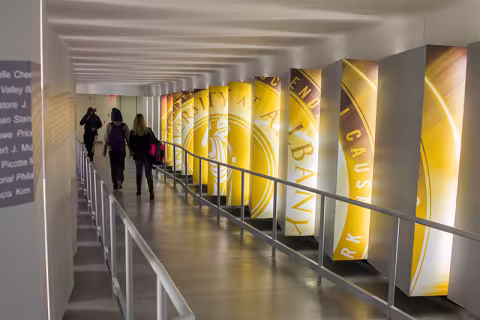 Students walking through the hallway in the School of Business