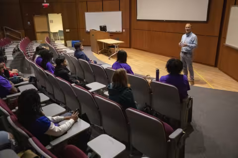 Andy Berglund speaks in front of the group in the RNA Institute auditorium.