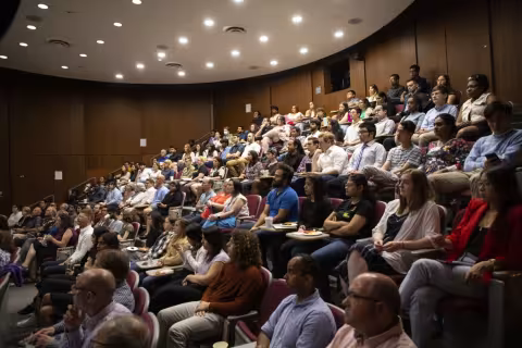 The D'Ambra auditorium is full of members of the RNA Institute community. 