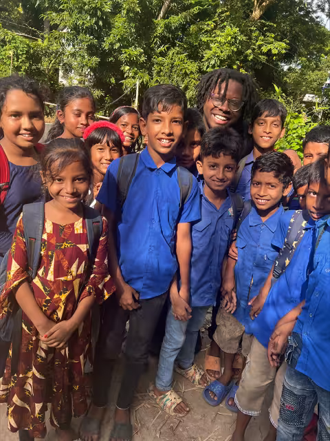 Ishe Mawasha of Md. Aynul Bari's summer NSF research team in Dhaka meets young students.