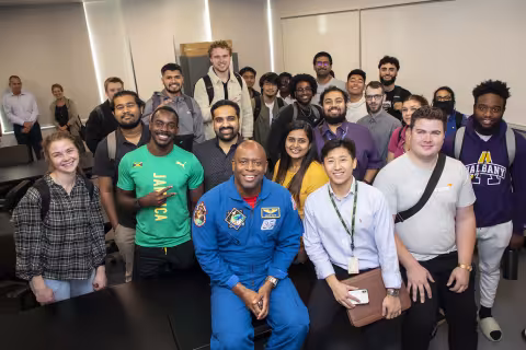 Former NASA Astronaut Leland Melvin with students at the College of Nanotechnology, Science, and Engineering.