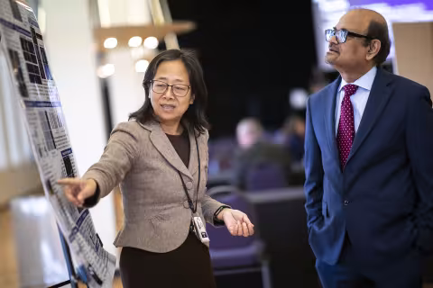 UAlbany Vice President for Research and Economic Development Thenkurussi (Kesh) Kesavadas listens to a presenter at the Research Showcase during R&E Week at UAlbany. (Photo by Patrick Dodson)