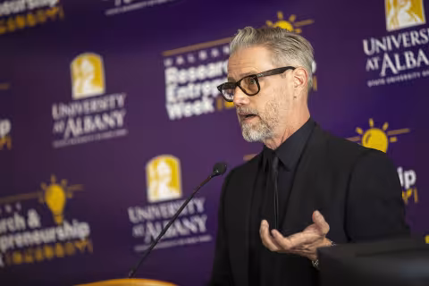 UAlbany Professor and Chair of Art and Art History Daniel Goodwin delivers the keynote address before the senior faculty recognition event at UAlbany's Research and Entrepreneurship Week.