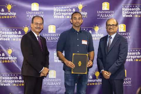 Kaalak Reddy, The RNA Institute, with UAlbany President Havidán Rodríguez and Vice President for Research and Economic Development Thenkurussi “Kesh” Kesavadas.