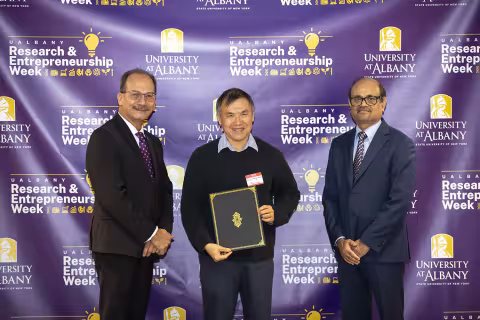 Ing-Nang Wang, Biological Sciences, with UAlbany President Havidán Rodríguez and Vice President for Research and Economic Development Thenkurussi “Kesh” Kesavadas.