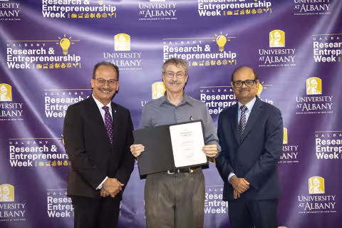 Robert Brainard, CNSE, with UAlbany President Havidán Rodríguez and Vice President for Research and Economic Development Thenkurussi “Kesh” Kesavadas.