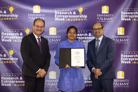Yamini Kumaran, CNSE, with UAlbany President Havidán Rodríguez and Vice President for Research and Economic Development Thenkurussi “Kesh” Kesavadas.