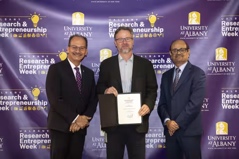 Benoit Boivon, CNSE, with UAlbany President Havidán Rodríguez and  Vice President for Research and Economic Development Thenkurussi “Kesh” Kesavadas.