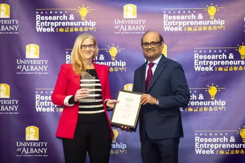 Ashley Fox and Biologist Alex Valm with Vice President for Research and Economic Development Thenkurussi (Kesh) Kesavadas