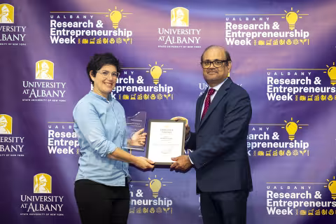 Associate Professor Beth Feingold with Vice President for Research and Economic Development Thenkurussi (Kesh) Kesavadas.