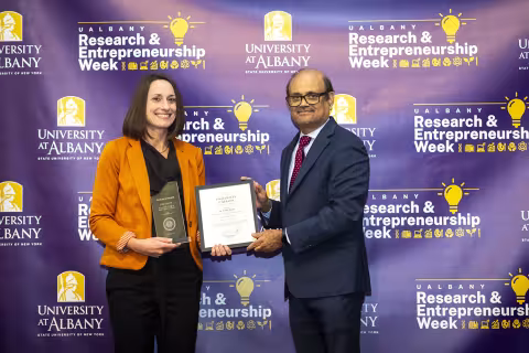 Professor Erika Martin with Vice President for Research and Economic Development Thenkurussi (Kesh) Kesavadas.