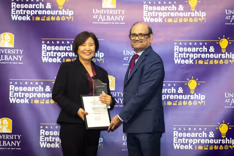Associate Professor Eunju Lee with Vice President for Research and Economic Development Thenkurussi (Kesh) Kesavadas.