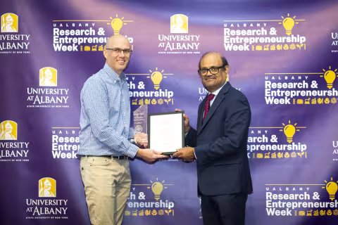 Senior Research Scientist Ken Halvorsen with Vice President for Research and Economic Development Thenkurussi (Kesh) Kesavadas.