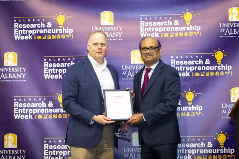 ASRC Research Associate Scott Miller with Vice President for Research and Economic Development Thenkurussi (Kesh) Kesavadas.