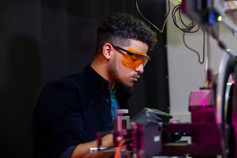 Student using equipment in a lab